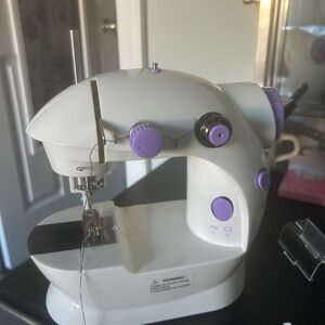 Compact White and Purple Sewing Machine